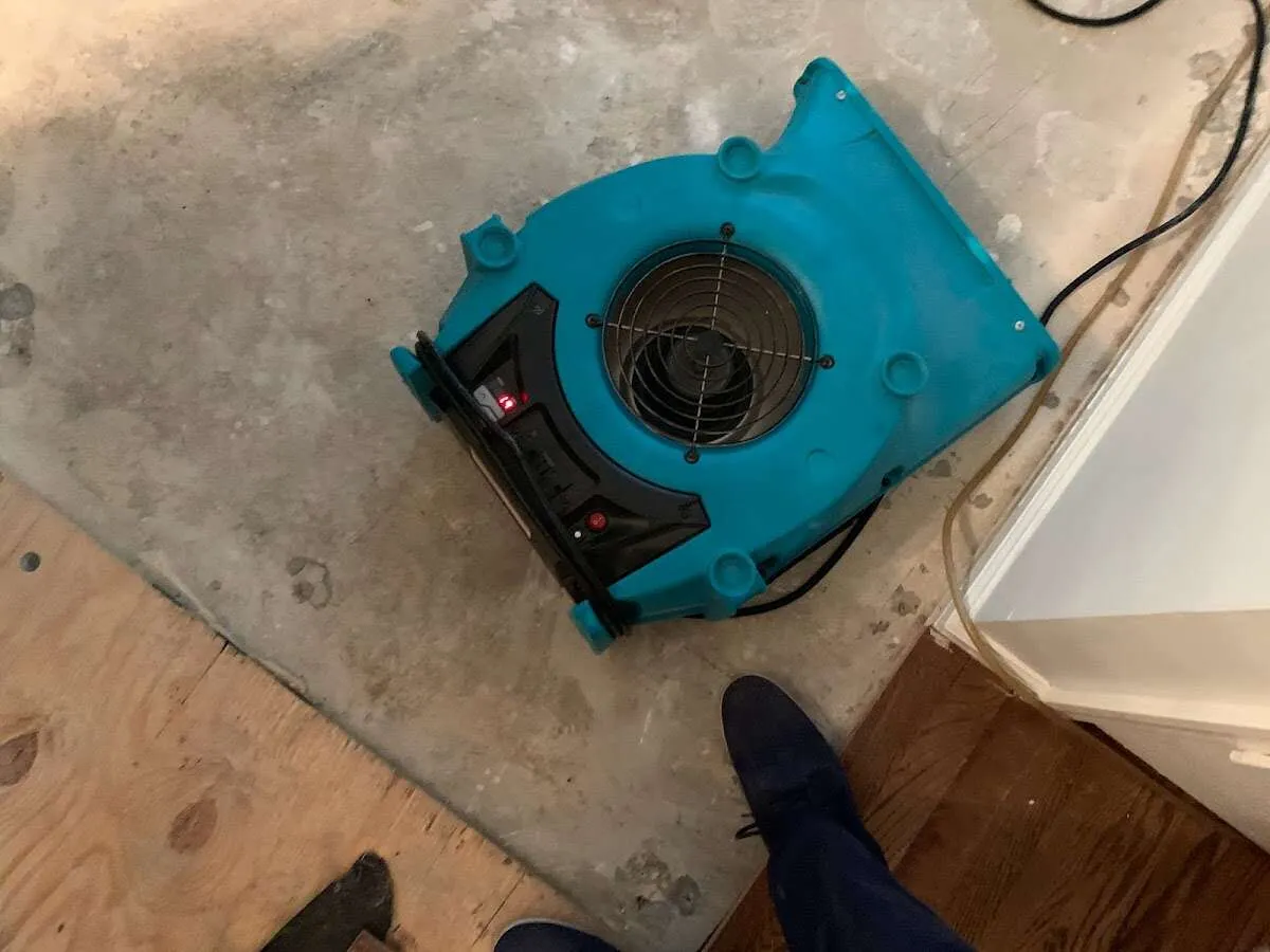 Air mover drying subfloor during Leak Detection & Repair in Bonadelle Ranchos